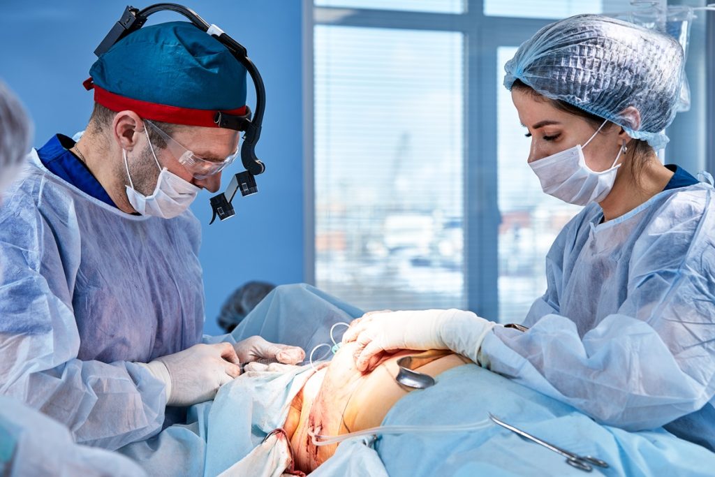 A pair of doctors conducting a surgery
