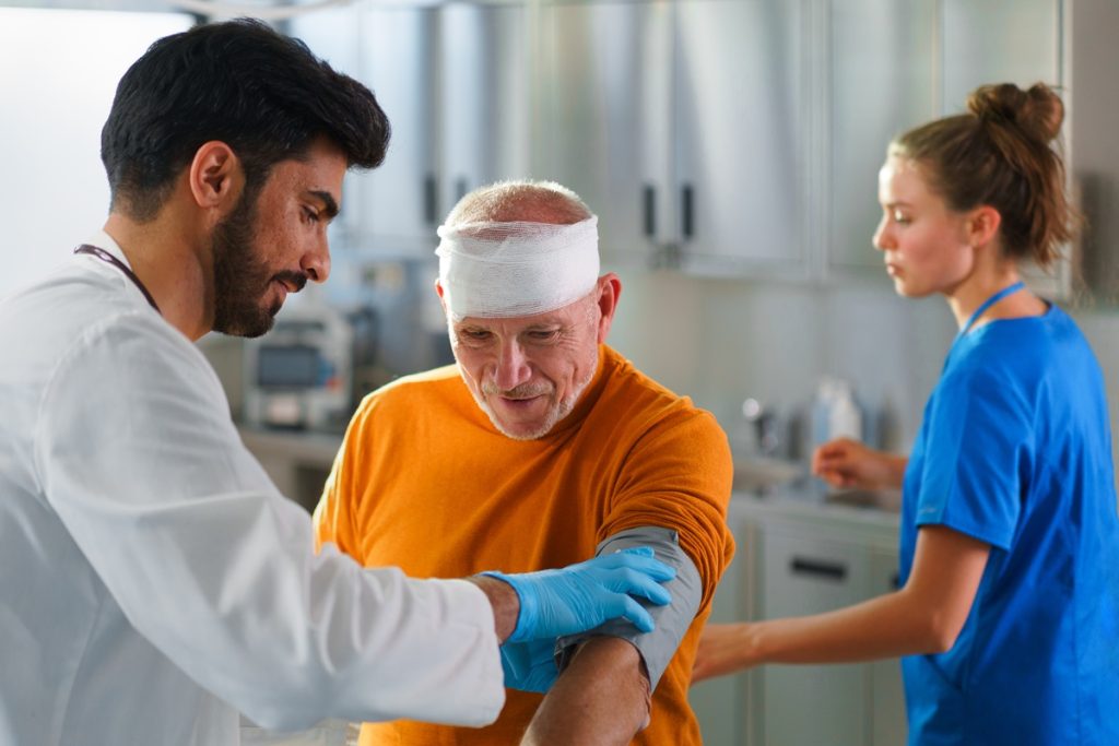 An elderly man getting medical care