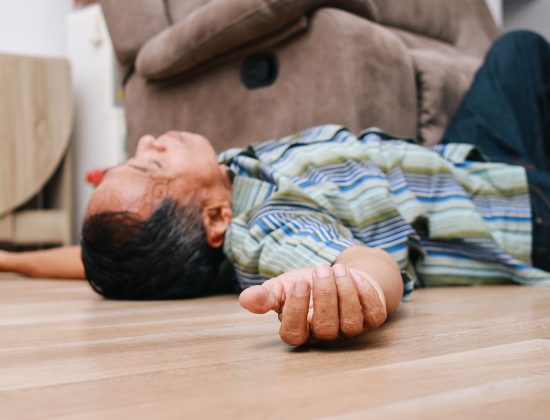 A man lying on the ground after a fall