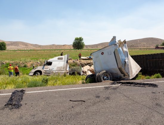 A semi-truck in the ditch after an accident